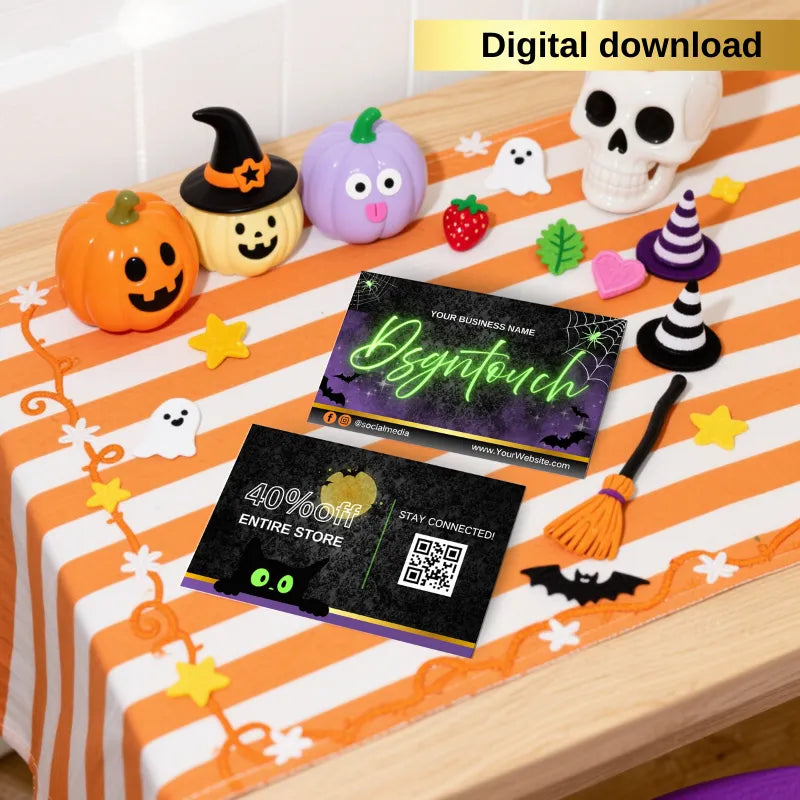 Spooky Halloween business card template for salons displayed on a festive Halloween-themed table.