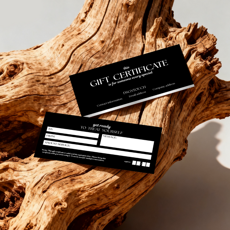 A person writing a message on the salon gift card, demonstrating its smooth, writable surface.