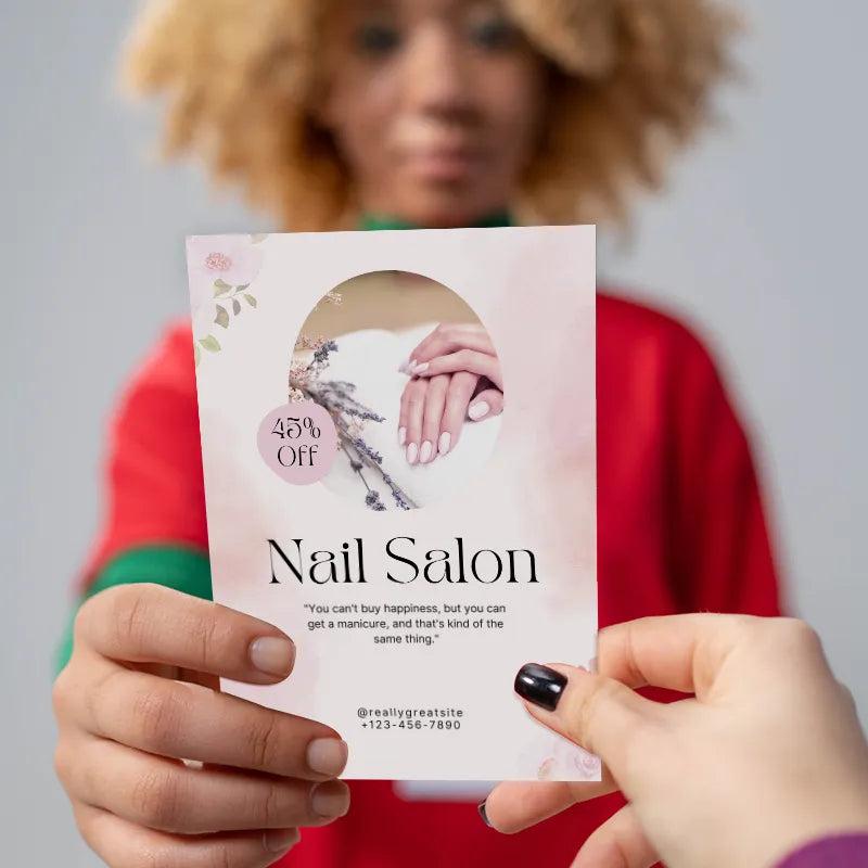 200g Beauty Salon Brochure showcasing a nail salon offering 45% off, held by a person with curly hair.
