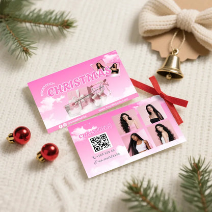 Christmas Glossy Business Cards for Salons displayed with festive decorations and a bow.
