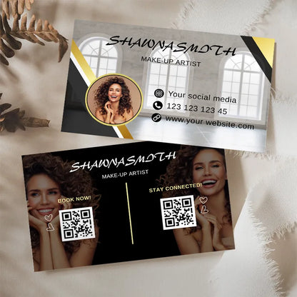 High-end glossy business cards showcasing makeup artist designs with QR codes and elegant layouts.