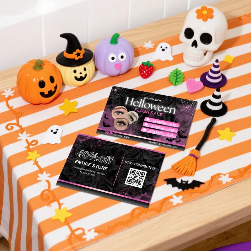 Halloween Lash Business Cards on a festive table with Halloween decorations and vibrant colors.