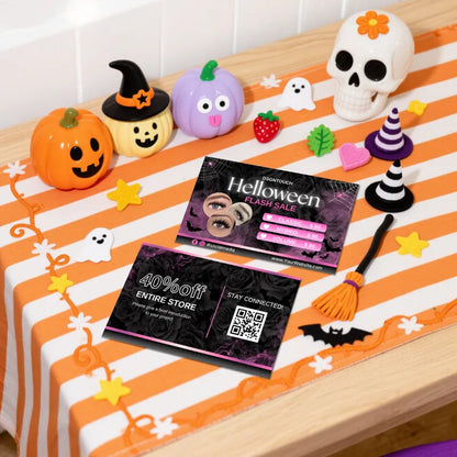 Halloween Lash Business Cards on a festive table with Halloween decorations and vibrant colors.