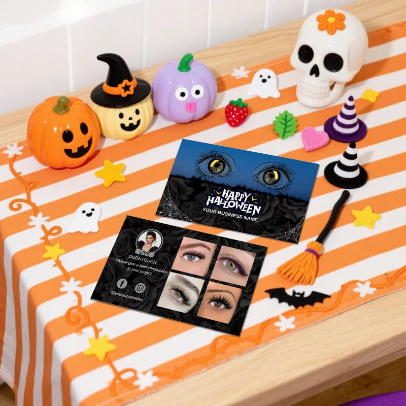 Halloween Lash Business Cards displayed on a festive table with Halloween decor and vibrant colors.