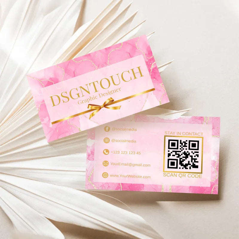 Elegant Business Cards featuring glossy lamination design by DSGNTOUCH with gold lettering on a pink background.