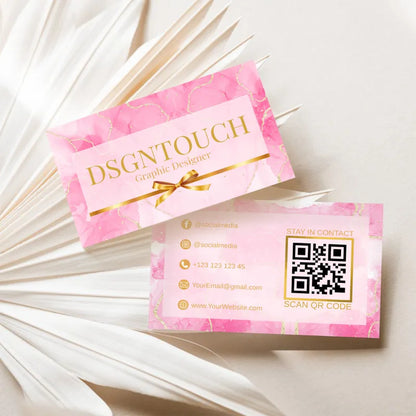 Elegant Business Cards featuring glossy lamination design by DSGNTOUCH with gold lettering on a pink background.