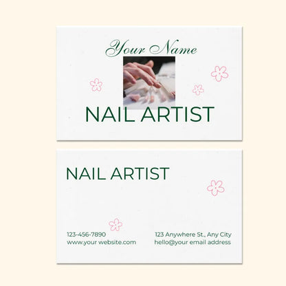 Customizable nail artist business card template: features "NAIL ARTIST" title, nail service photo, contact info, and pink floral accents.