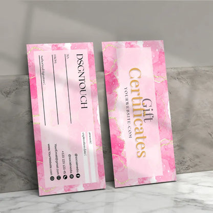 Printable gift certificate template displayed on a marble surface, featuring pink design and elegant font.