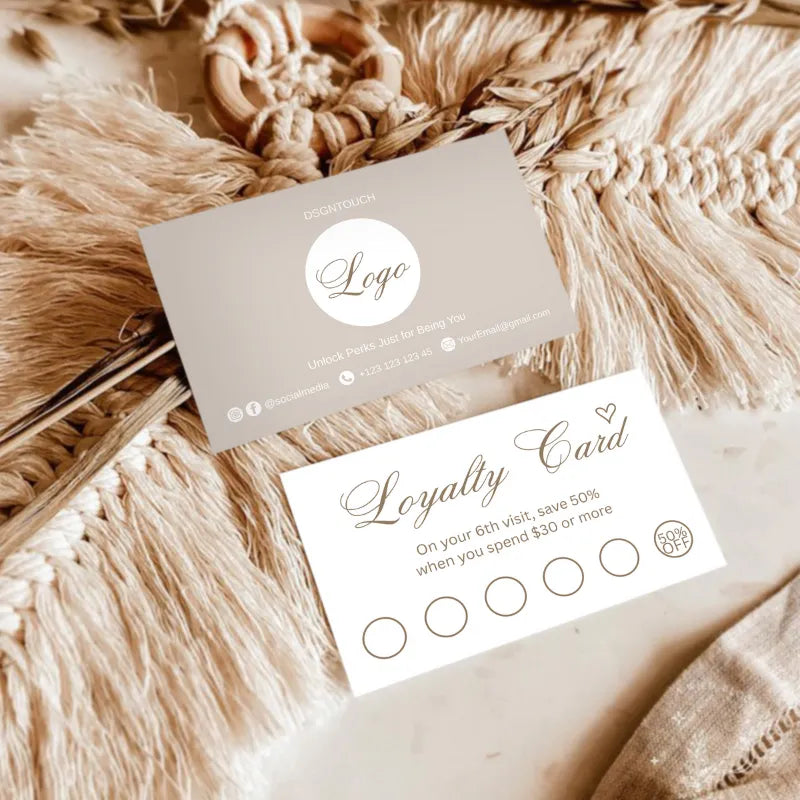 Close-up view of DSGNTOUCH loyalty stamp cards showing visit-based rewards and discount structure